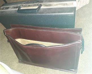 (2) Briefcases. (1) is genuine leather, the other is a hard plastic