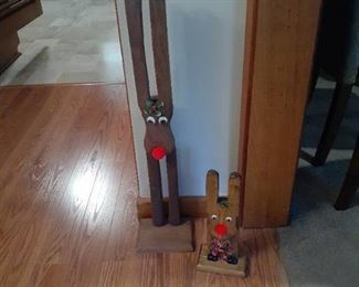 (2) Wooden reindeer with googly eyes. Tallest is 31" and small one is 13"
