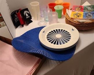 Tupperware sippy cups, other plastic glasses, plastic and wicker paper plate holders, more