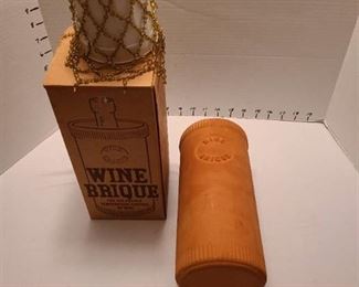 Clay wine brique with wine bottle adornment