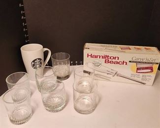 Starbucks mug, Hamilton Beach electric knife and glasses