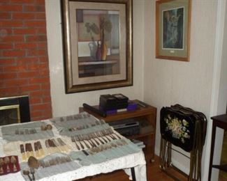 Art work, silver plate flat ware, TV tables, old VCRs.