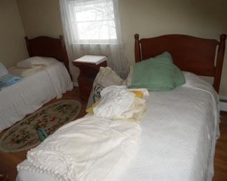 Rock maple twin size beds. Old chenille spreads. Lots of sheets and blankets, some towels and curtains.