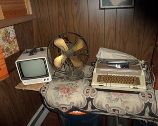 Smith Corona Electric Typewriter, antique fan, old TV.