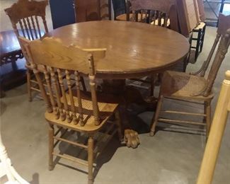 sturdy round wooden table and 4 chairs. will be sold separately.