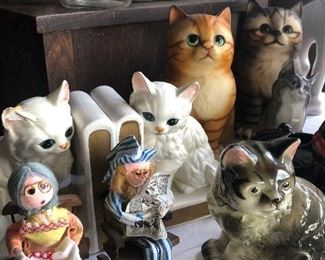 Lots of cat figurines 