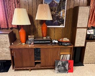 Vintage console, orange funky lamps, speakers, and pioneer stereo