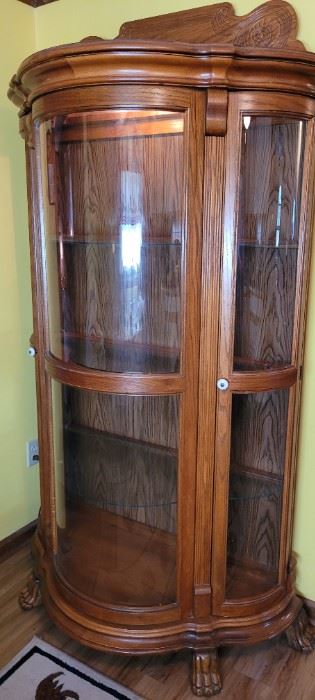 lovely oak bow-front lighted glass shelf cabinet