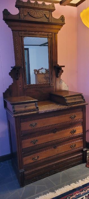 Antique carved marble-top dresser with mirror, 6 1/2 feet tall