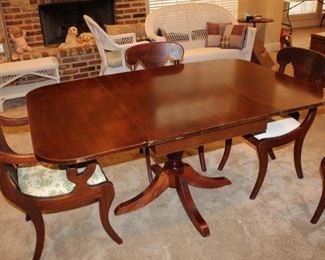 mahogany drop-leaf dining table and four chairs