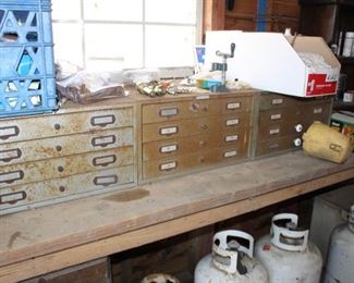 three vintage four-drawer steel filmstrip drawers