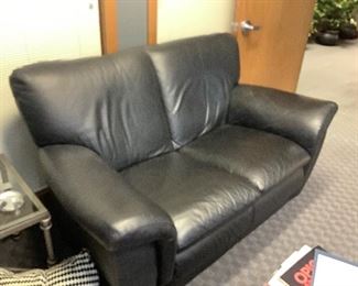 Black leather love seat