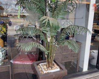 large fake plant and planter 