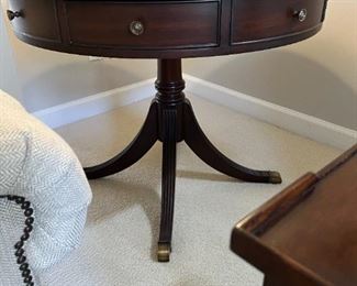 Ethan Allen Drum Table with drawers on brass castors with Aged Saddle finish, 35.50” dia x 29.50’h    