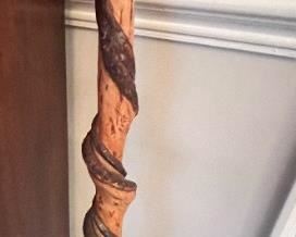 Vintage hand-carved walking cane with spiral design and marble inside handle