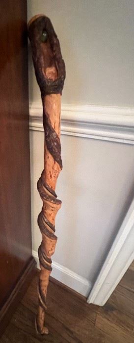Vintage hand-carved walking cane with spiral design and marble inside handle