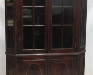 419 - Lovely mahogany 2 door corner cabinet Broken arch top, shell finial Oval inlaid blind doors at bottom key in door 76 1/2 x 42 x 32
