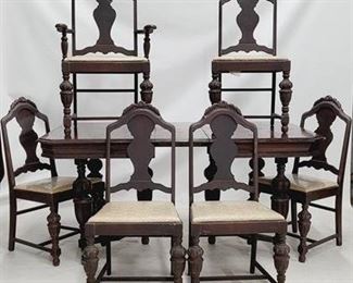 1687 - Vintage carved 7 pc dining set, pop up leaf table 31 x 67 x 40 chairs 40.5 x 20.5 x 22
