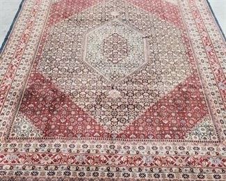 1729 - Wool pile Persian room size rug - 10.6 x 7.9 Has worn spot in center
