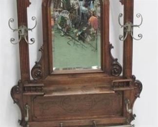 6047 - Victorian walnut carved hall tree with brass hardware, umbrella rack, beveled mirror, coat hooks 87 x 37 x 10
