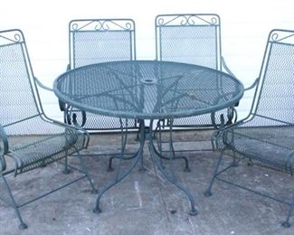 6184 - Metal 5 pc patio set with spring rockers table 28 x 42 chairs 37.5 x 22 x 19
