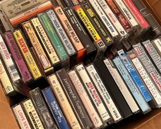Lots of CDs, DVDs, cassettes, and VHS