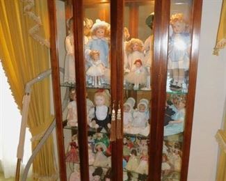 Burl Walnut Lighted Curio Cabinet And Doll Collection