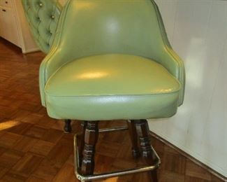 Bar stools with green vinyl upholstery