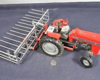 Die Cast Massey Ferguson tractor with hay bale loader attachment