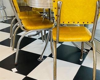 2_____$500 
MCM Retro Atomic chrome yellow kitchen table w/4 chairs + 1
58Lx36Wx30