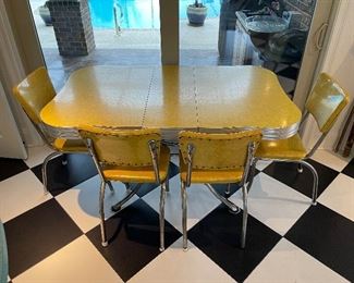 2_____$500 
MCM Retro Atomic chrome yellow kitchen table w/4 chairs + 1
58Lx36Wx30