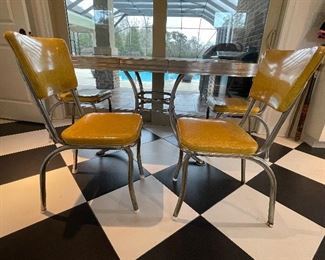2_____$500 
MCM Retro Atomic chrome yellow kitchen table w/4 chairs + 1
58Lx36Wx30