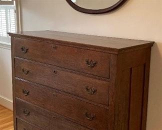 Antique chest of drawers and vintage mahogany oval mirror