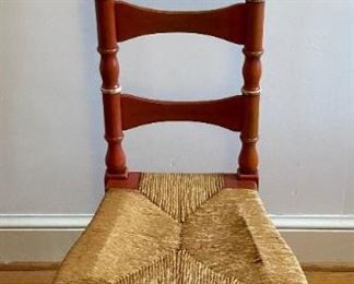 Vintage distressed cane bottom ladder back chair