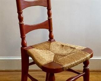 Vintage distressed cane bottom ladder back chair
