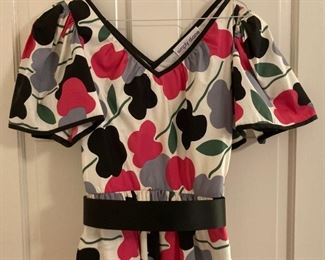 Vintage clothes including bathing suits, shorts, t-shirts, shirts, sweaters, pants, dresses and more