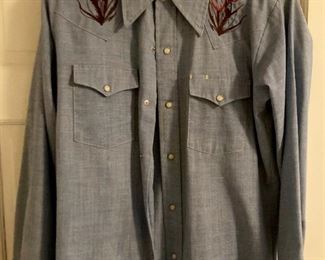 Vintage clothes including bathing suits, shorts, t-shirts, shirts, sweaters, pants, dresses and more