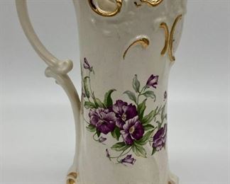 Signed floral pitcher
