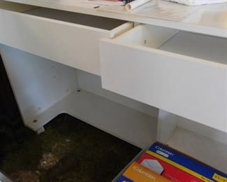 Backside of the long sewing table with drawers