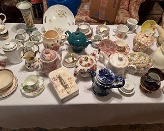 Tons of teapots to include many older chintz patterns
