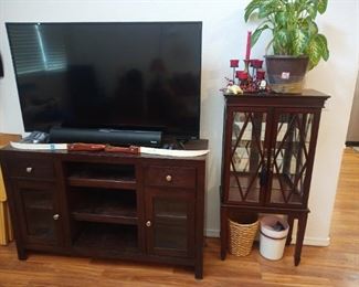 Large tv, soundbar and stand. Cute little display cabinet