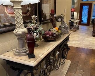 This piece is phenomenal. Marble top and base with heavy iron scroll base. Bring help moving this one!