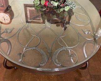 Heavy Iron scrolled base with round glass top 