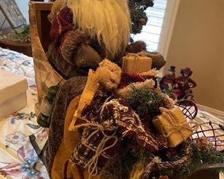 Designer Santa in his sleigh with fur wrap