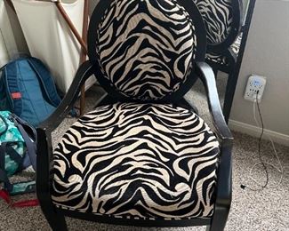Black wooden oversized office chair with zebra print