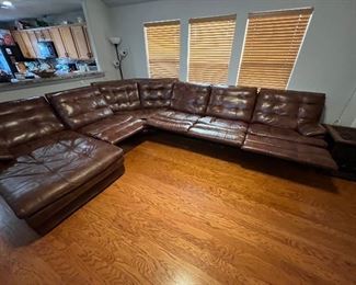 Gorgeous oversized sofa with 5 reclining seats. All seats recline besides corner piece