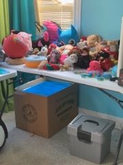 Lots of stuffed toys and office items.