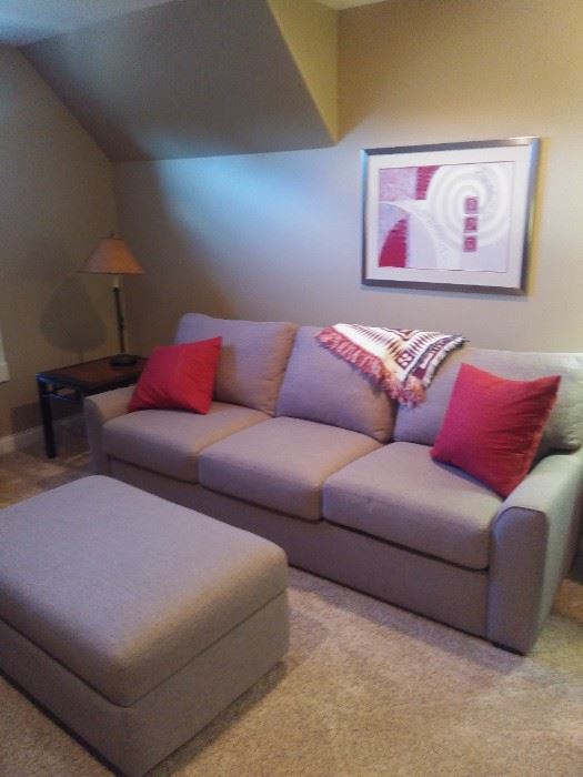 American Leather sleeper sofa with matching storage ottoman