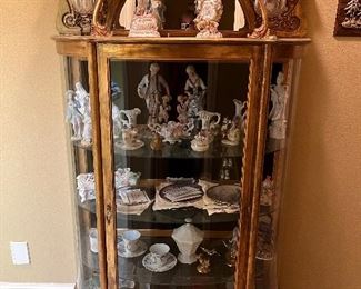 Curio cabinet full of collectibles
