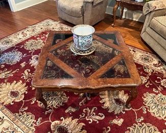 Glass coffee table has matching 2 end tables. The rug is 10X7.7 and is vibrant red